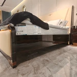 Cream Leather Upholstered Bed with Dark Natural Wood Veneer Trim, Embossed Brand Emblem & Copper-Accented Hardware